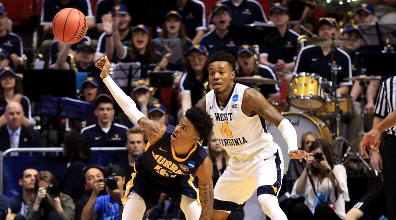 SAN DIEGO, CA - MARCH 16: Ja Morant #12 of the Murray State Racers reaches for a loose ball against Brion Sanchious #4 of the Murray State Racers in the first half during the first round of the 2018 NCAA Men’s Basketball Tournament at Viejas Arena on March 16, 2018 in San Diego, California. (Photo by Sean M. Haffey/Getty Images)