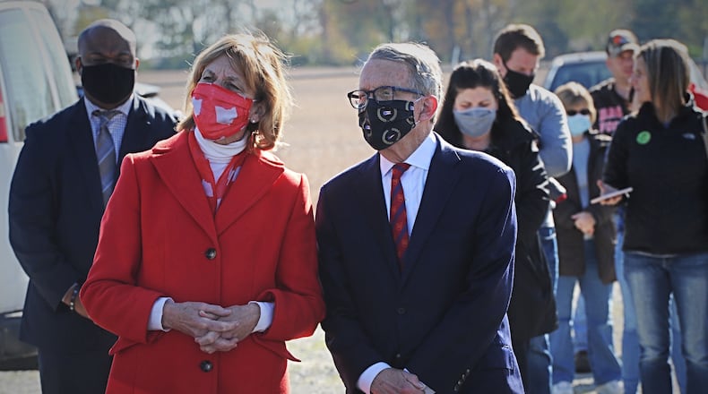 Governor Mike DeWine along with his wife Fran, wait in line to vote at the Cedarland event Center in Cedarville on Tuesday, Nov. 3, 2020. MARSHALL GORBY\STAFF