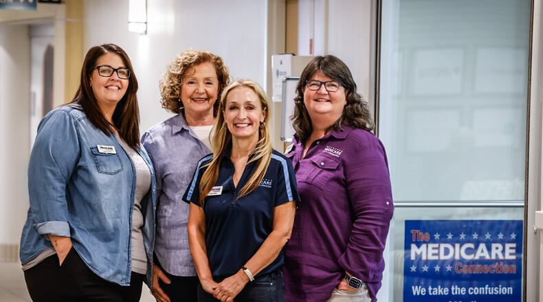 Medicare Connection employees from left, Ashley Rowles, Marcia Bechtel, Angela Miller and owner Tracy Goodpaster help people wade through Medicare requirements. The office is located 424 East Stroop Road in Kettering. JIM NOELKER/STAFF