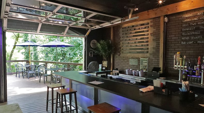 The rear patio and bar at the former 316 Tap & Barrel Grill, which is being renovated and will reopen as Mad River Tavern in October, owners said. BILL LACKEY/STAFF