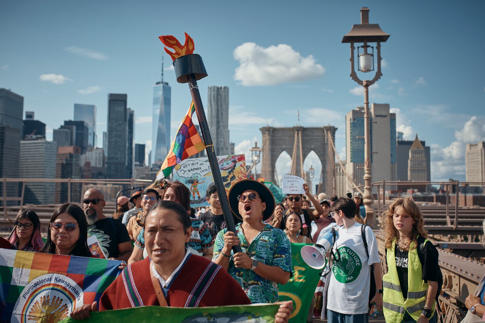 FILE - Protesters shout slogans as they cross the Brooklyn Bridge during a Youth Climate Strike march to demand an end to the era of fossil fuels, Friday, Sept. 20, 2024, in New York. (AP Photo/Andres Kudacki, File)