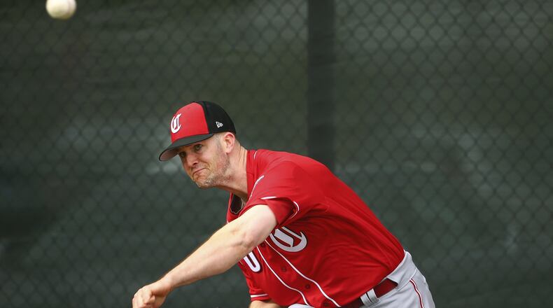 Cincinnati Reds pitcher Alex Wood throws a pitch during workouts at the Reds spring training baseball facility, Wednesday, Feb. 13, 2019, in Goodyear, Ariz. (AP Photo/Ross D. Franklin)