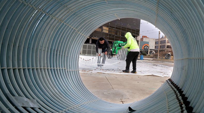 It was finally warm enough for Derrick Snowden and his crew to take apart the outdoor ice skating rink Monday, Feb. 24, 2025 on the Springfield City Hall Plaza. With temperatues below freezing for most of the year, the Holiday in the City attraction couldn't be moved. BILL LACKEY/STAFF