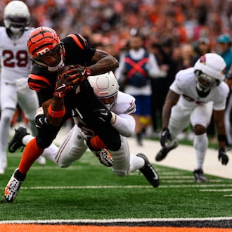 Bengals receiver Ja'Marr Chase reaches out to score a touchdown in the first quarter of their game against the Arizona Cardinals on Sunday, Dec. 28 at Paycor Stadium. JEREMY MILLER / CONTRIBUTED PHOTO