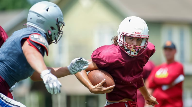 Northeastern High School junior running back Cody Lookabaugh carries the ball during their scrimmage game against Urbana at Climber Stadium last month. CONTRIBUTED PHOTO BY MICHAEL COOPER