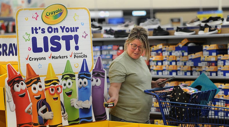 Crystal Houser, of Kettering, shops for school supplies for her two children at the Meijer store located at 4075 Wilmington Pike in Kettering Tuesday, July 25, 2023. Ohio’s Sales Tax Holiday runs from Aug. 4 through Aug. 6. Tax-free items include school supplies and books that cost $20 or less per item and clothing at $75 or less per item. MARSHALL GORBY/STAFF