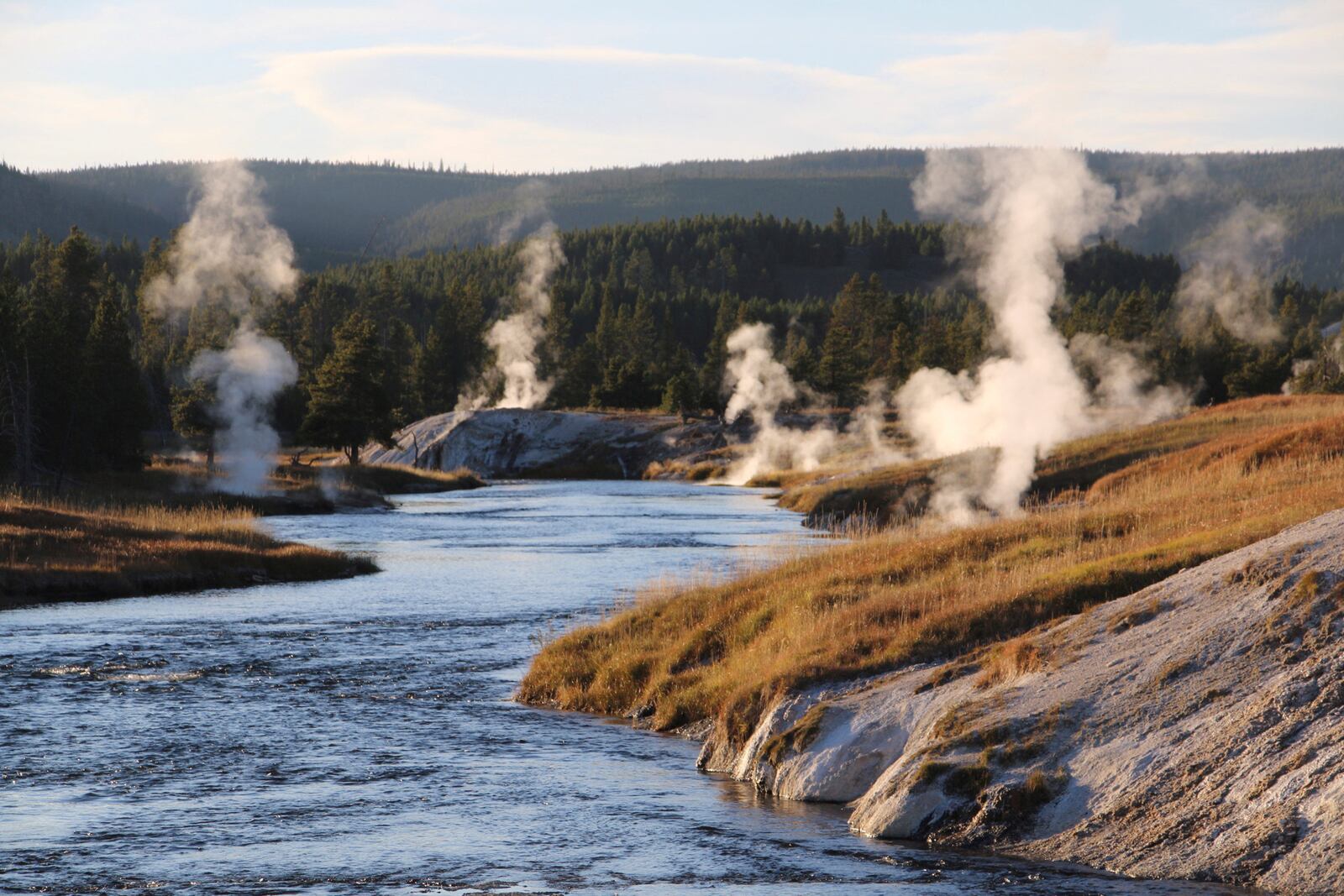 Geysers and other geothermal features emit steam at the Upper Geyser Basin of Yellowstone National Park, Sept. 25, 2023. (AP Photo/Hannah Schoenbaum)