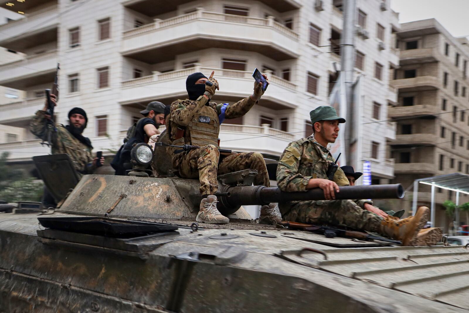 Members of Syria's security forces deploy in the town of Sahnaya, south of Damascus, on Wednesday, April 30, 2025, after earlier clashes with Druze fighters left at least 11 people dead. (AP Photo/Omar Albam)