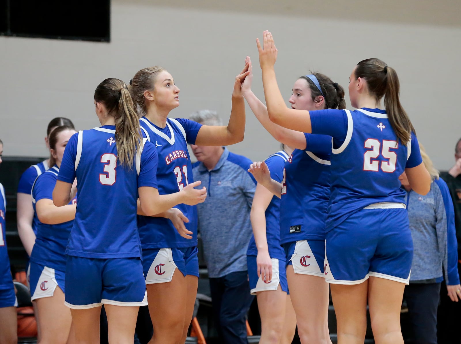 Carroll players celebrate after a 50-42 win at Waynesville in a non-league game on Monday, Jan. 5, 2026. STEVEN WRIGHT / STAFF