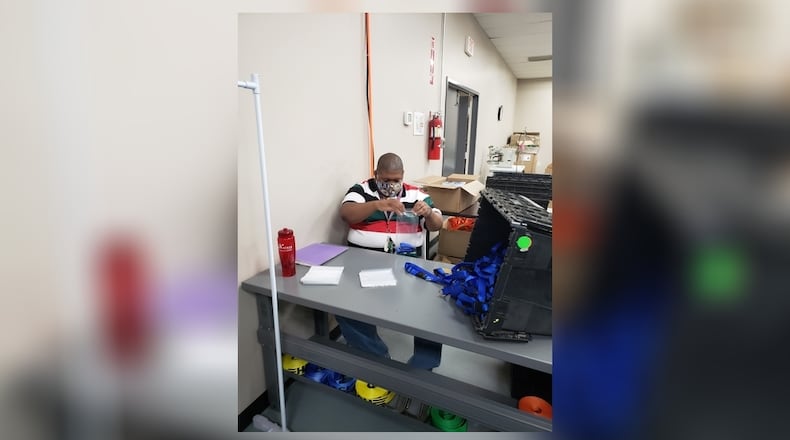 The Abilities Connection (TAC) employee Paris Patterson works on the organization's PetAbilities line of pet products made at its Springfield location. PetAbilities will have a product display at the next Downtown DORA Night Series Dog Days of Summer event in Springfield on Thursday. Courtesy photo