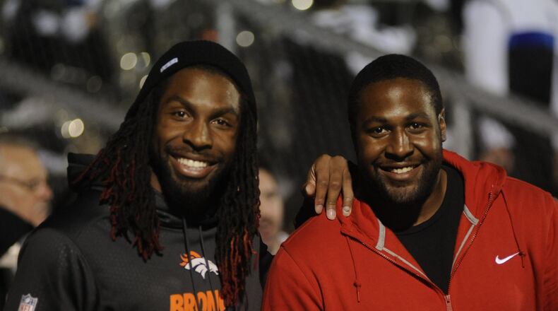 Brothers and Miamisburg grads David (Broncos) and Ken Bruton watch the game. Miamisburg hosted Springboro in the final high school football game at Harmon Field on Friday, Oct. 23, 2015. MARC PENDLETON / STAFF