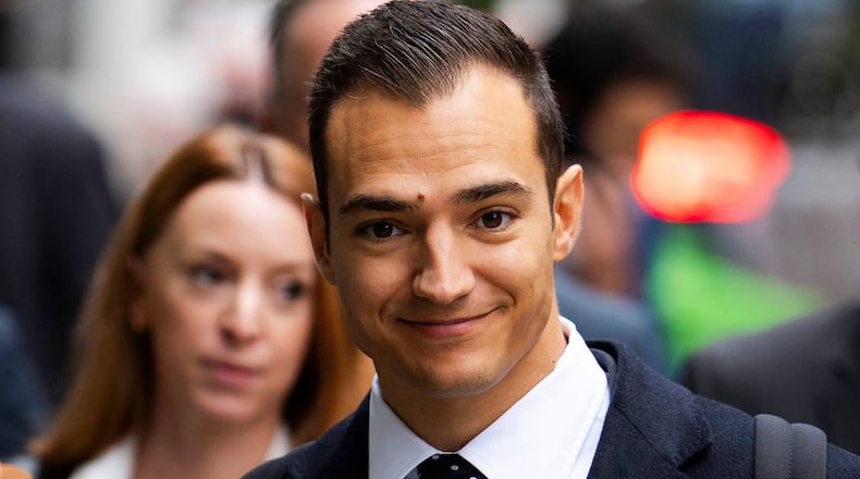 Spanish racing driver Alex Palou, arrives at the Rolls Building of the Royal Courts of Justice to give evidence in McLaren's legal claim against him, in central London, Friday, Oct. 10, 2025. (Jordan Pettitt/PA via AP)