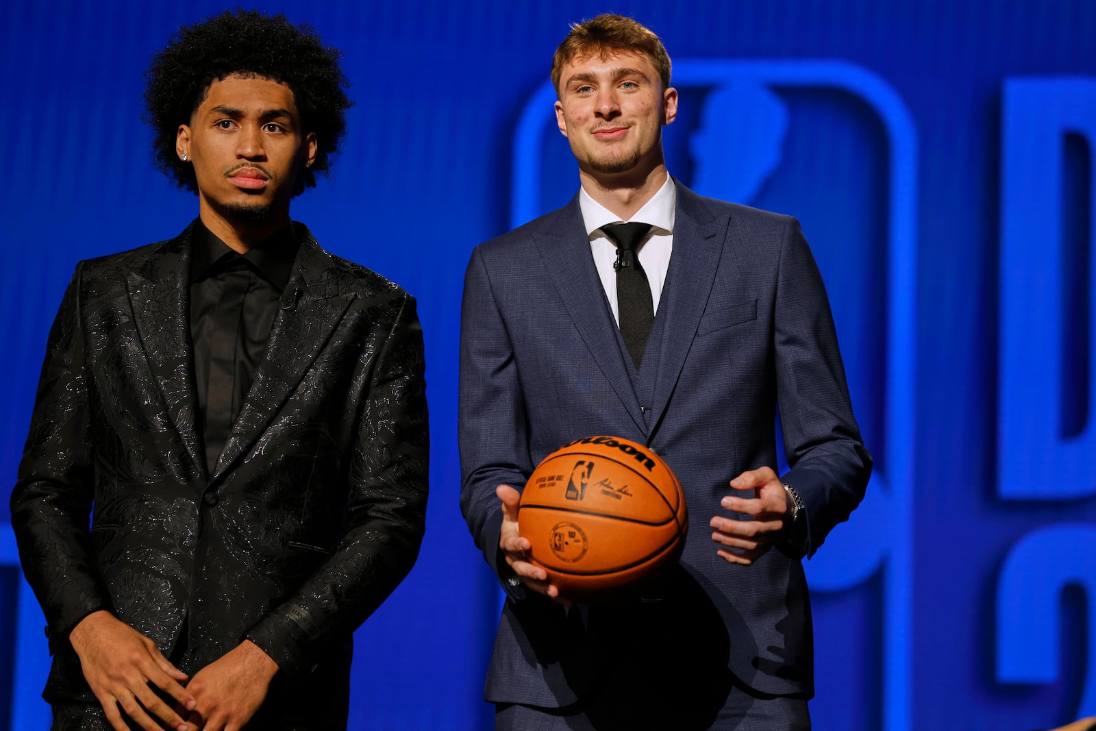 Dylan Harper, left, and Cooper Flagg gather for a photo before the start of the first round of the NBA basketball draft, Wednesday, June 25, 2025, in New York. (AP Photo/Adam Hunger)