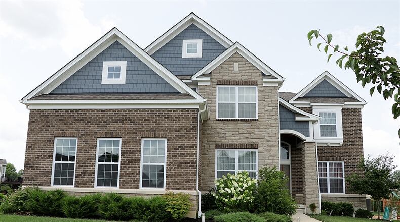 The stone-and-Hardiplank house is located within the Wynstone subdivision of Washington Twp. There is a three-car garage and a wooden rear deck on an open half-acre property. Kathy Tyler/CONTRIBUTED