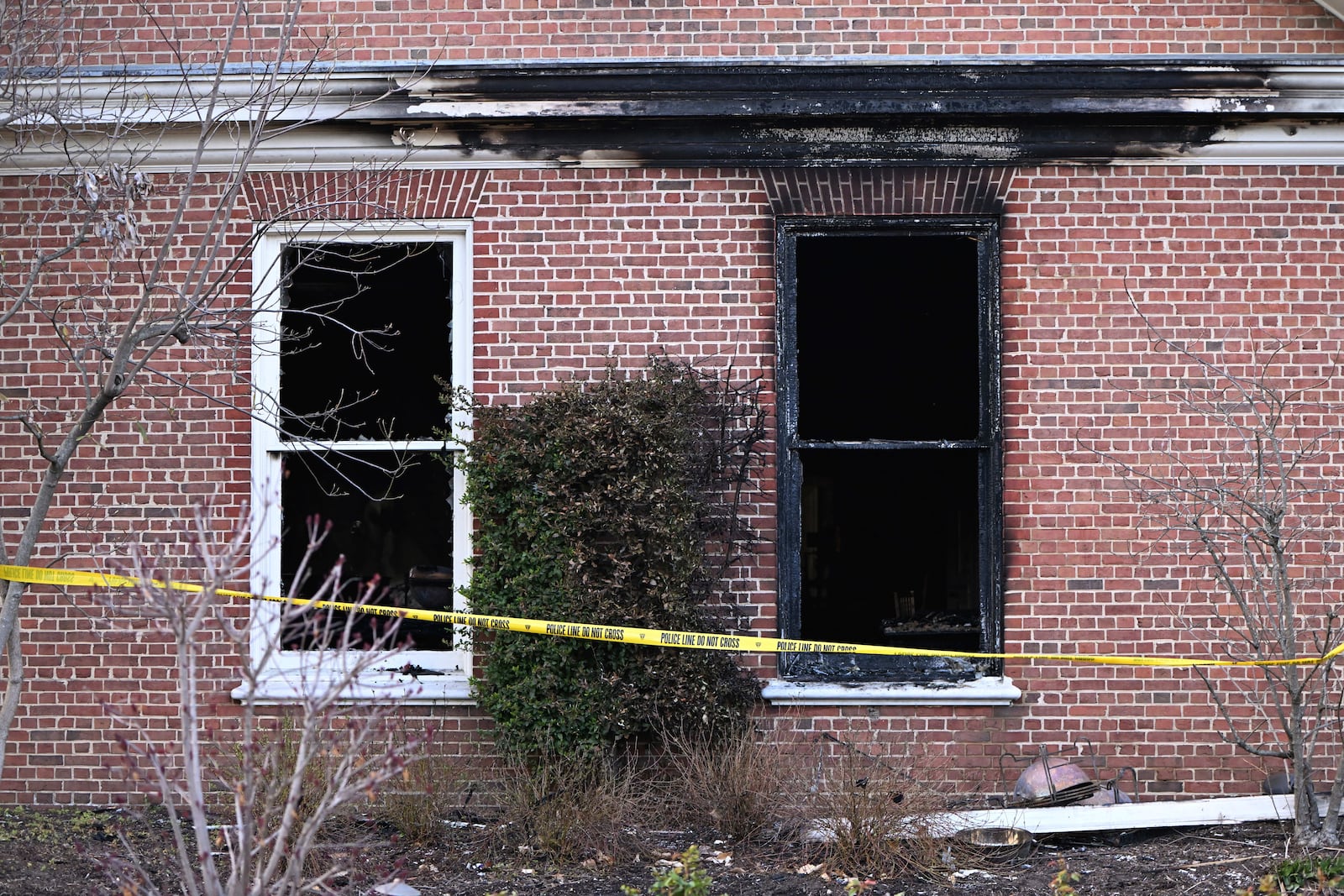 Charred wood trim and brick are visible at the Pennsylvania governor's official residence after a man was arrested in the alleged arson that forced Gov. Shapiro, his family and guests to flee in the middle of the night on the Jewish holiday of Passover, Sunday, Apr. 13, 2025, in Harrisburg, Pa. (AP Photo/Marc Levy)