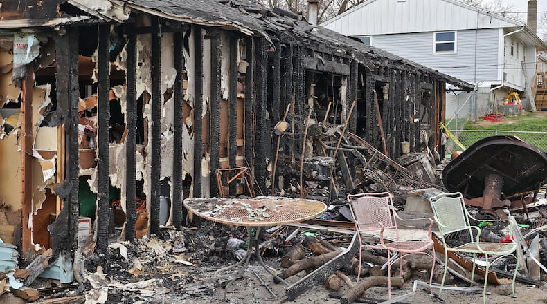 The rear view of the house at 618 Bowser Street shows the extent of the damage Monday after a fire on Sunday destroyed most of the home. BILL LACKEY/STAFF