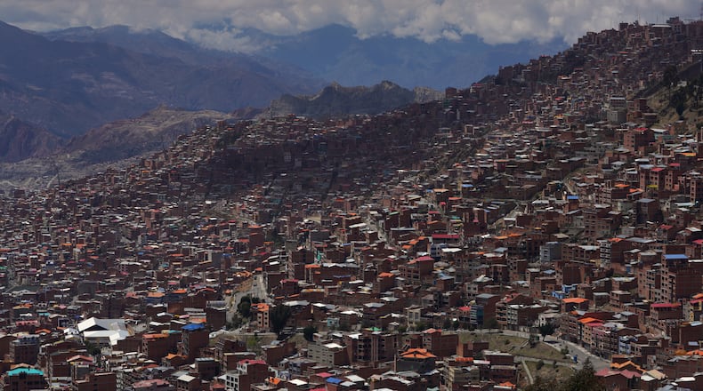 FILE - Clouds hang over the mountains surrounding La Paz, Bolivia, Oct. 19, 2025. (AP Photo/Ivan Valencia, File)