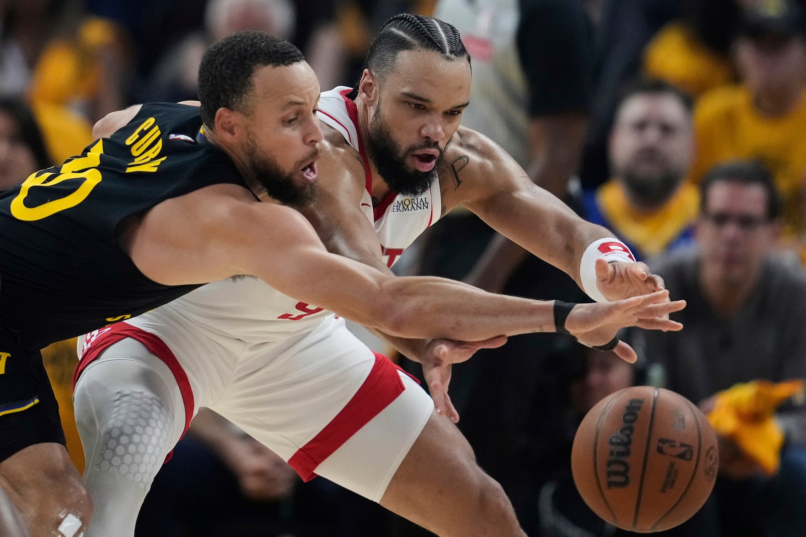 Golden State Warriors guard Stephen Curry, left, takes the ball away from Houston Rockets forward Dillon Brooks during the first half of Game 6 of an NBA basketball first-round playoff series Friday, May 2, 2025, in San Francisco. (AP Photo/Godofredo A. Vásquez)