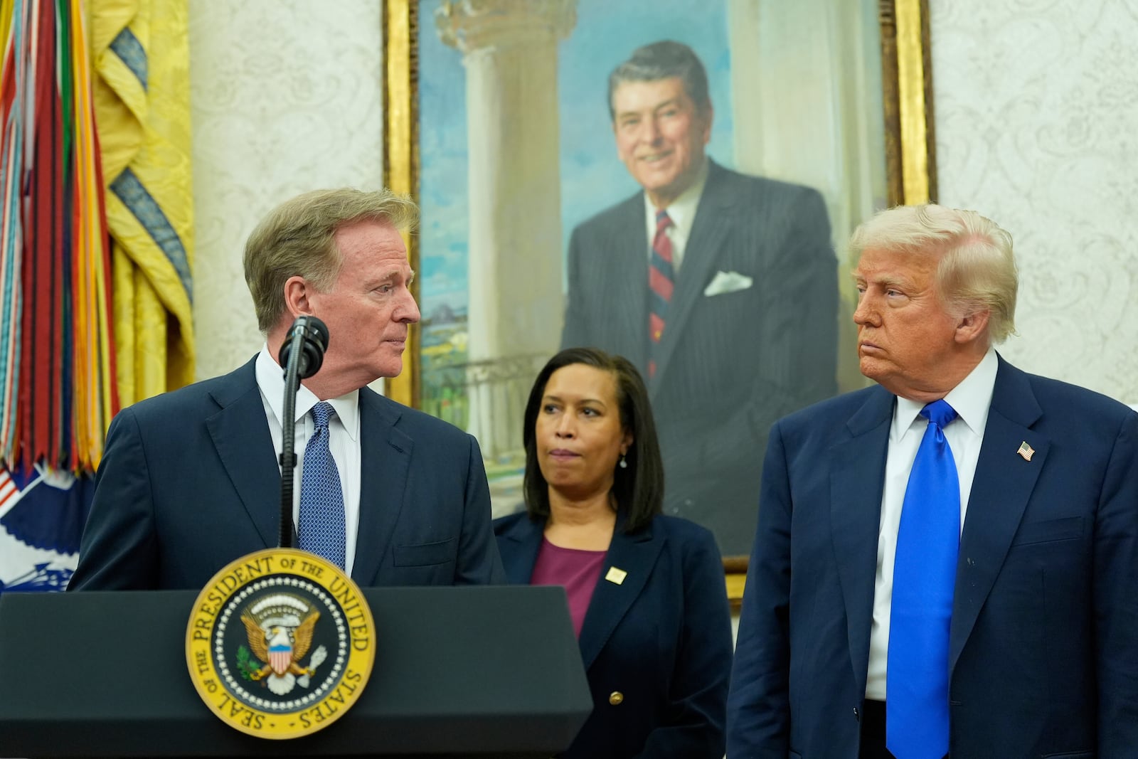 NFL Commissioner Roger Goodell, from left, speaks as District of Columbia Mayor Muriel Bowser and President Donald Trump listen during an event to announce that the 2027 NFL Draft will be held on the National Mall, in the Oval Office of the White House, Monday, May 5, 2025, in Washington. (AP Photo/Alex Brandon)