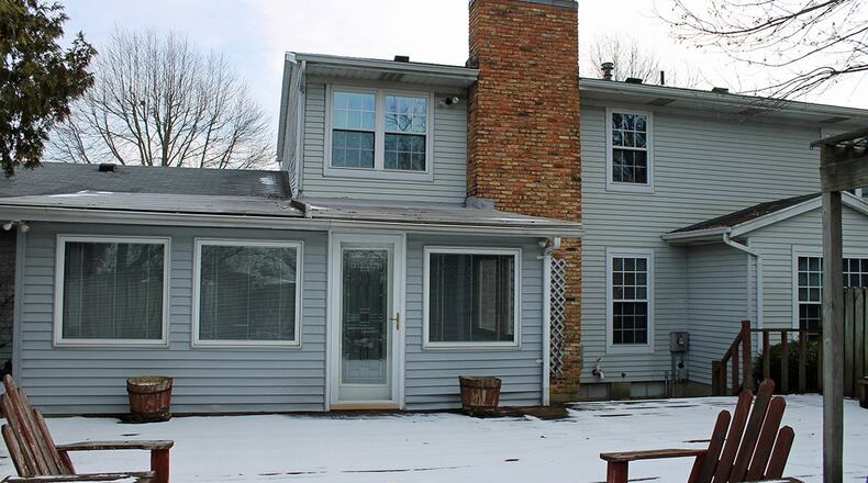 A sun room opens to the 30-by-35-foot rear deck.