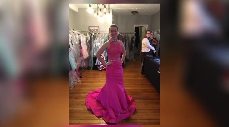 Caiden Butler modeling one of the dresses while Heather Mercuri and Julianne Howell look on. SUBMITTED PHOTO