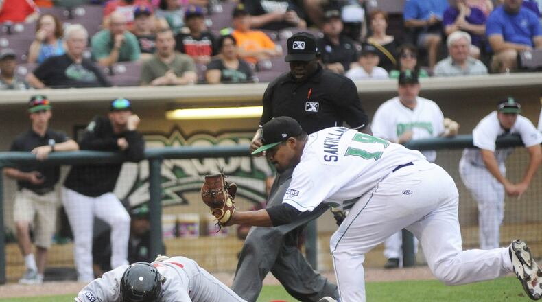 Dragons pitcher Tony Santillan tags out Mitchell Hansen of the Loons. The Great Lakes Loons defeated the Dragons 8-3 at Dayton’s Fifth Third Field on Thursday, June 15, 2017. MARC PENDLETON / STAFF