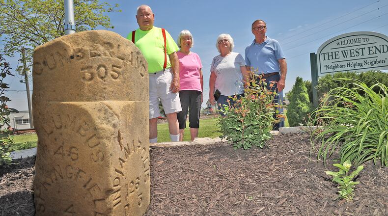 Some of those responsible for the marker's placement along West Main Street are, from left, Bob Hulsizer, Flossy Hulsizer, Judy Brown and Bill Smith. BILL LACKEY/STAFF
