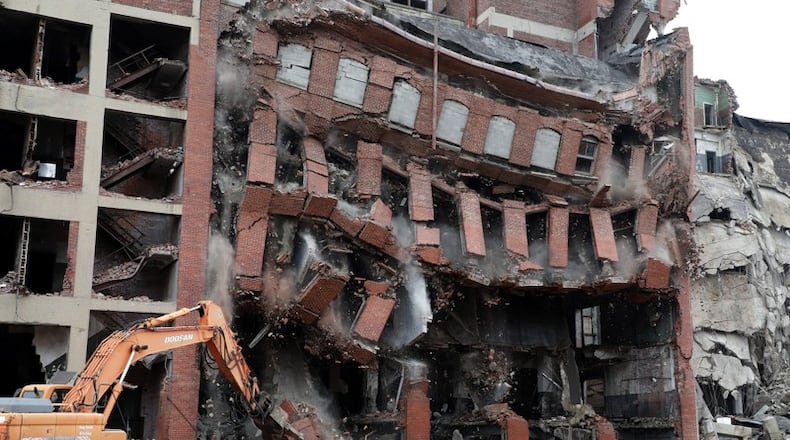 Walls at Crowell-Collier building in Springfield fall in as demolition picks up pace. BILL LACKEY/STAFF