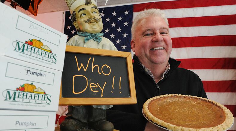 Brian Phillips, owner of Mehaffie Pies, displays the Joe Burrow 9" pumpkin pie. The business is offering, Who Dey! Super Bowl Party Packs. MARSHALL GORBY\STAFF