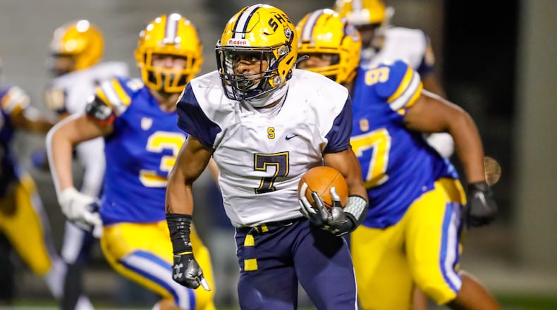 Springfield High School senior Jayvin Norman runs the ball during their game against Olentangy on Friday night at Hilliard Darby High School. The Wildcats won 37-24. Michael Cooper/CONTRIBUTED