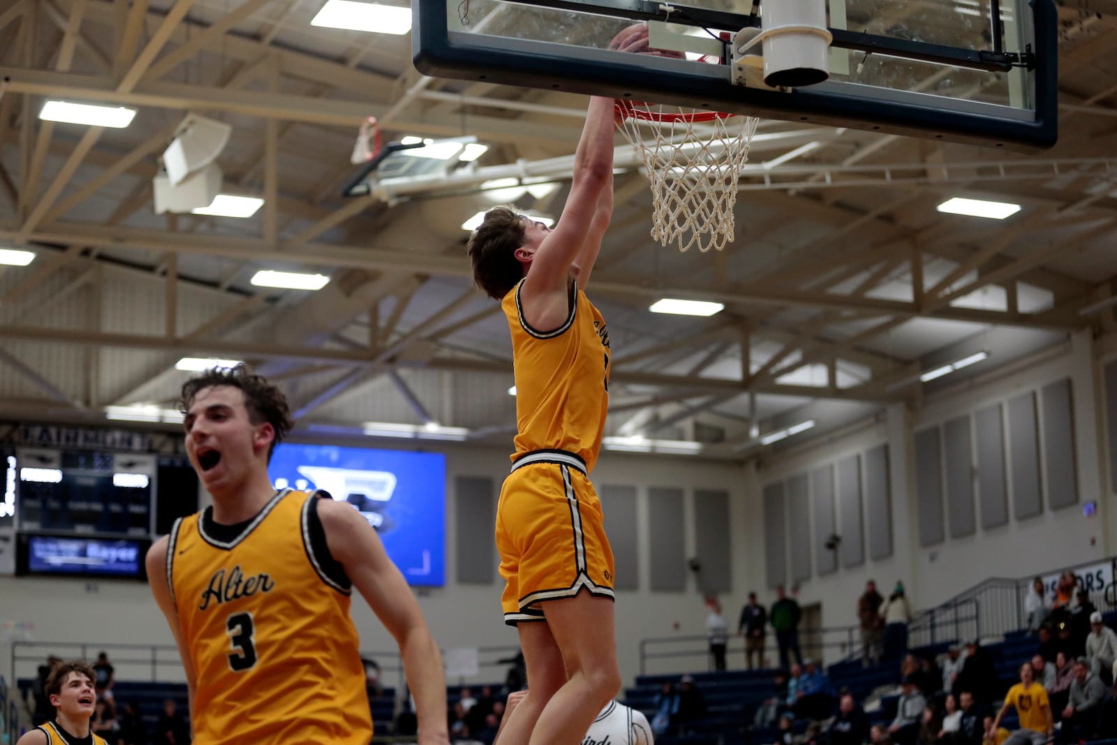 Alter senior Grant Guess completes a two-handed dunk off an assist by junior Peyton Bakos during their game against Fairmont on Tuesday, Feb. 3, 2026, at Trent Arena in Kettering. Alter won 70-61. STEVEN WRIGHT / STAFF