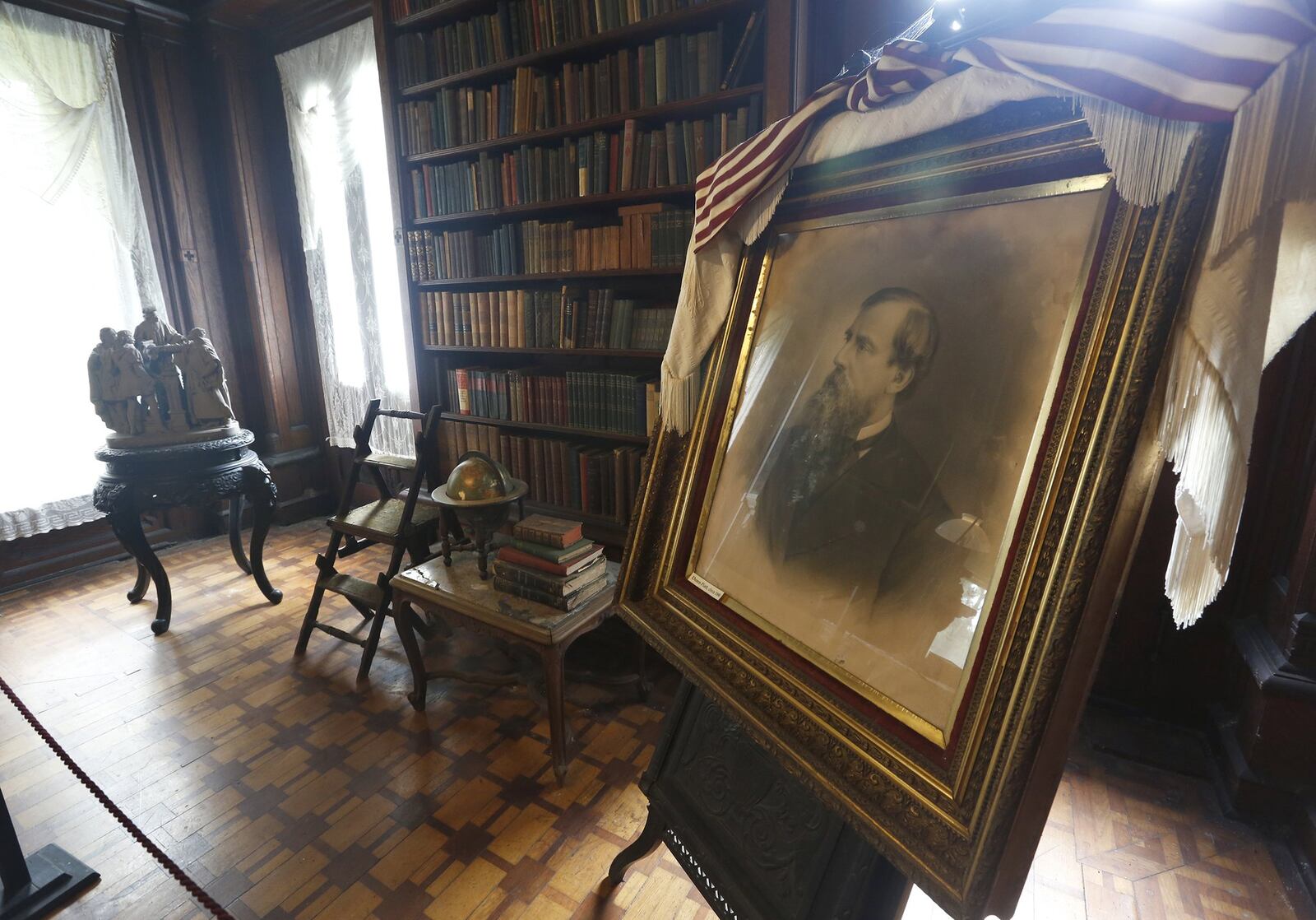 A framed portrait of Donn Piatt sits in the library of Mac-A-Cheek the home he built in West Liberty. Donn Piatt and his brother Abram built a pair of homes in Logan County called the Piatt Castles. LISA POWELL / STAFF