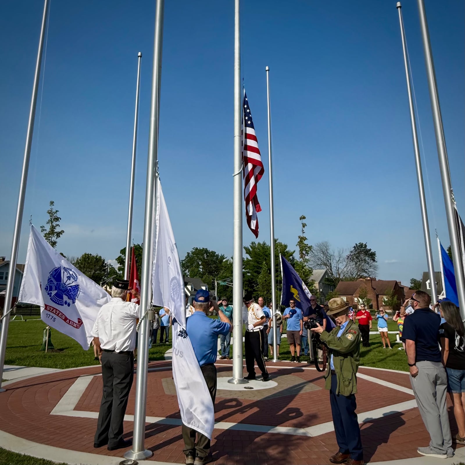 Military members and veterans from all six branches of the U.S. military salute as the American flag is raised for the first time at Fairborn’s new Memorial Park. The dedication took place Thursday, July 3, 2025. CONTRIBUTED