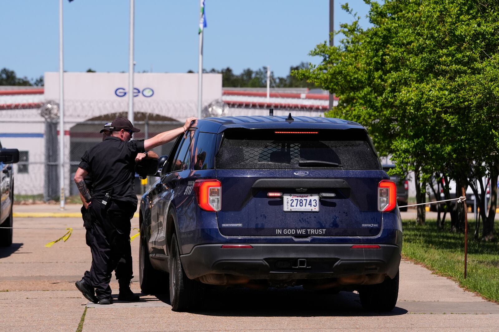 Security personnel stand post outside the Central Louisiana ICE Processing Center in Jena, La., during an immigration hearing for Mahmoud Khalil, the Columbia University activist facing deportation for his role in pro-Palestinian campus protests, Friday, April 11, 2025. (AP Photo/Gerald Herbert)