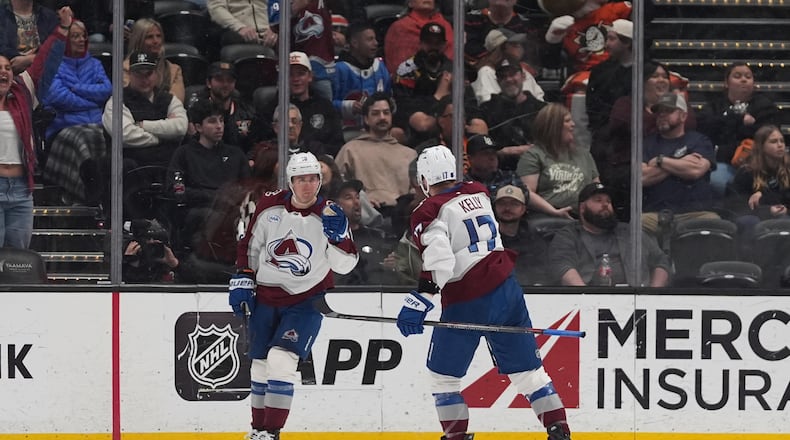 Colorado Avalanche center Parker Kelly (17) celebrates his goal with teammate right wing Valeri Nichushkin during the third period of an NHL hockey game against the Anaheim Ducks Tuesday, March 3, 2026, in Anaheim, Calif. (AP Photo/Gregory Bull)