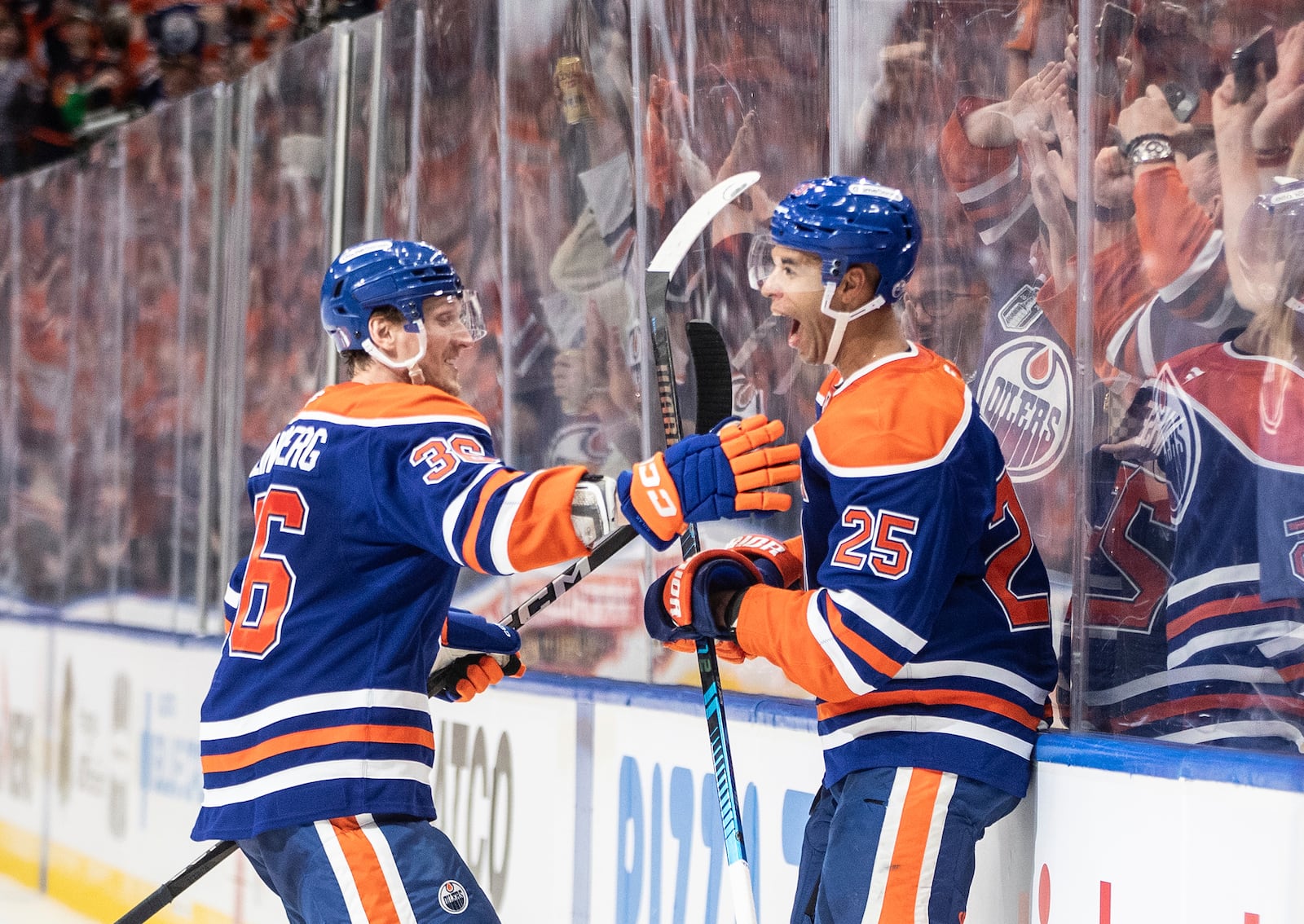 Edmonton Oilers' John Klingberg (36) and Darnell Nurse (25) celebrate a goal against the Los Angeles Kings during the second period of an NHL hockey game in Edmonton, Alberta, Thursday, May 1, 2025. (Jason Franson/The Canadian Press via AP)