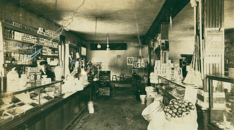 Edward L. Monger, a former machinist who came to Ohio from Indiana in the 1880s, opened a grocery store in Tremont in the early 1900s. The interior of the store is shown here around 1910 when a young Earl R. McKinley was the clerk. McKinley later went on to work at one of the many Kroger s bakery and groceries in Springfield and Edward Monger moved to New Carlisle where he opened Monger s Grocery on Main Street. CONTRIBUTED BY THE CLARK COUNTY HISTORICAL SOCIETY