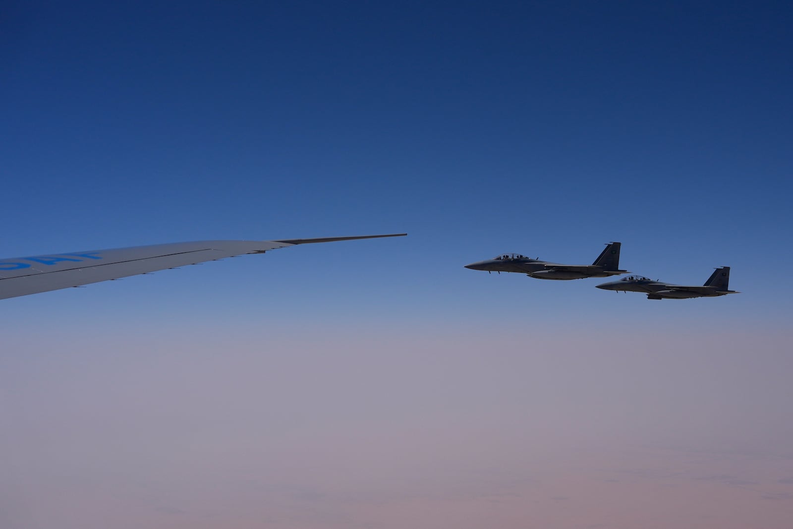 Saudi Air Force F-15 warplanes escort Air Force One carrying President Donald Trump as it arrives in Saudi Arabia, Tuesday, May 13, 2025. (AP Photo/Alex Brandon)