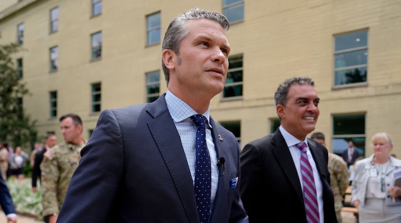 FILE- Secretary of Defense Pete Hegseth, left, and Under Secretary of Defense for Research and Engineering Emil Michael, right, arrive to look at a display of multi-domain autonomous systems in the Pentagon courtyard, Wednesday, July 16, 2025, in Washington. (AP Photo/Julia Demaree Nikhinson, File)