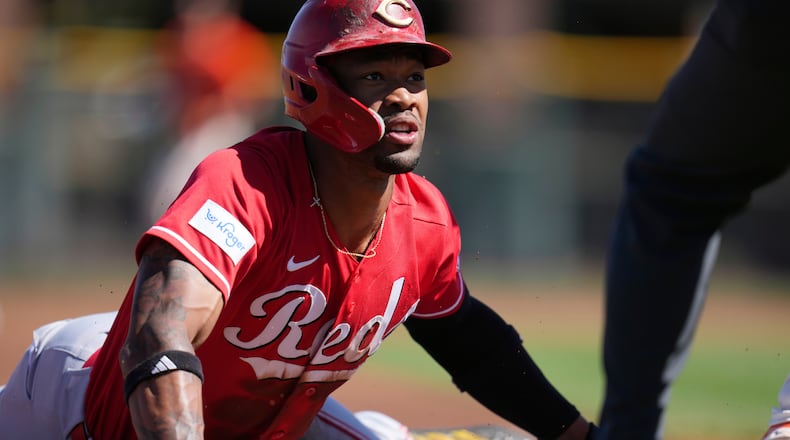 Cincinnati Reds' Will Benson steals third base against the San Francisco Giants during the first inning of a spring training baseball game Friday, March 6, 2026, in Scottsdale, Ariz. (AP Photo/Ross D. Franklin)