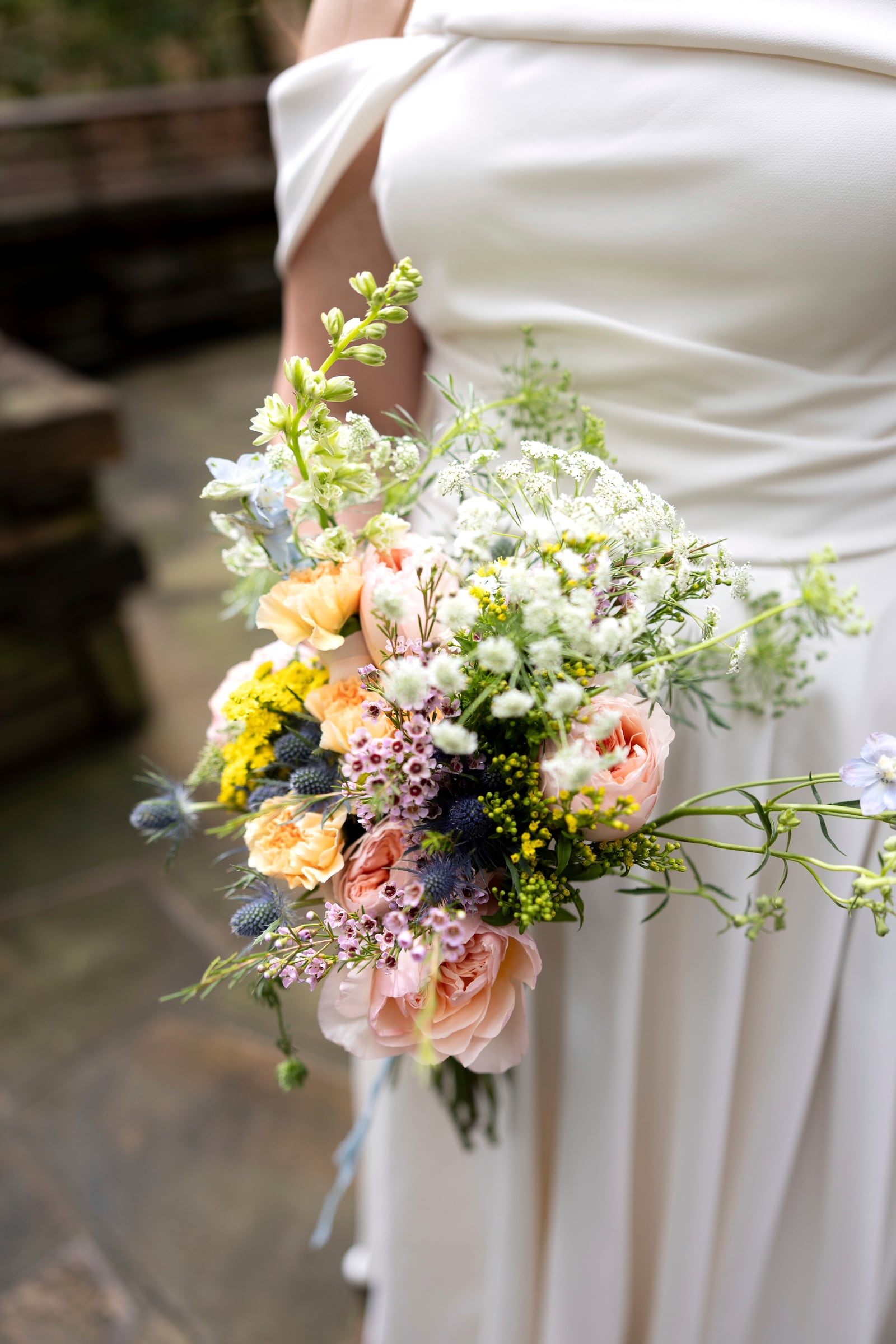 This Sept. 24, 2023, photo shows a bridal bouquet at a wedding in Hot Springs, Ark. Wedding vendors and bridal couples of today have been impacted by U.S. tariffs on countries around the globe. (Madi McGraw Photography via AP).