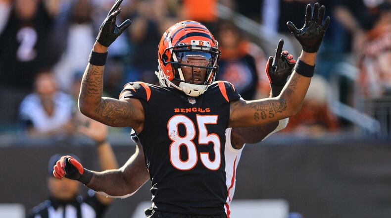 Cincinnati Bengals wide receiver Tee Higgins (85) celebrates a touchdown against the Atlanta Falcons in the second half of an NFL football game in Cincinnati, Fla., Sunday, Oct. 23, 2022. (AP Photo/Aaron Doster)