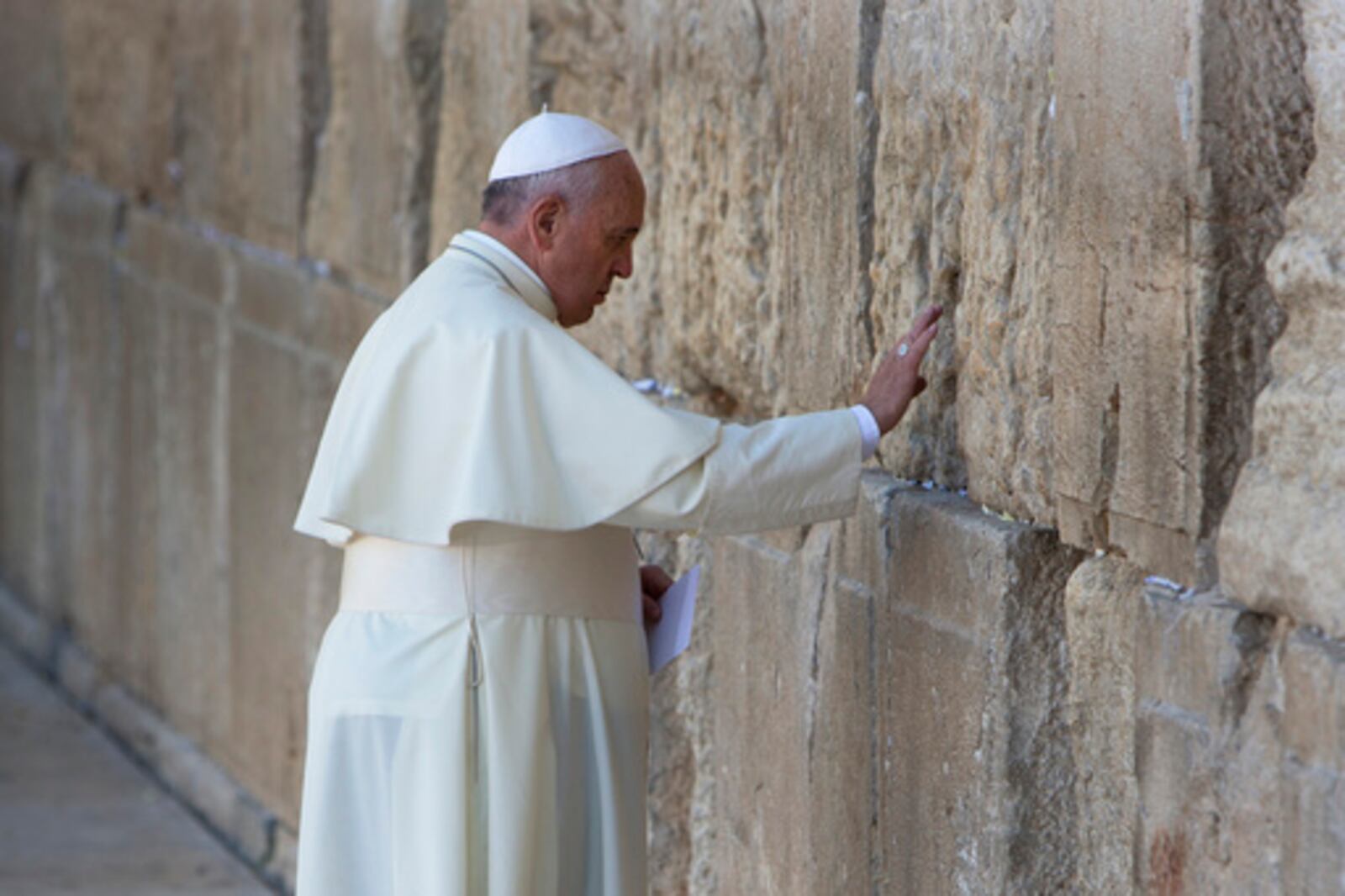 FILE - Pope Francis prays in front of the Western Wall, in Jerusalem's Old City, Monday, May 26, 2014. (AP Photo/Oded Balilty, file)
