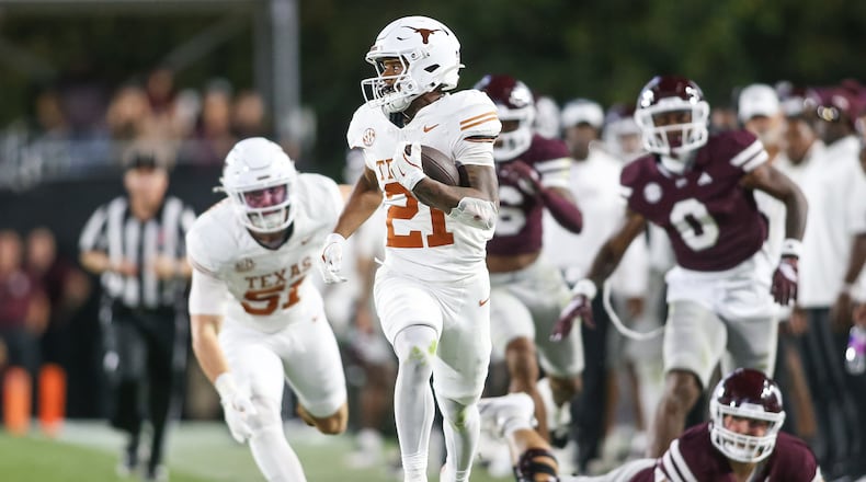 Texas wide receiver Ryan Niblett (21) runs a punt return for a touchdown against Mississippi State during the second half of an NCAA college football game in Starkville, Miss., Saturday, Oct. 25, 2025. (AP Photo/James Pugh)