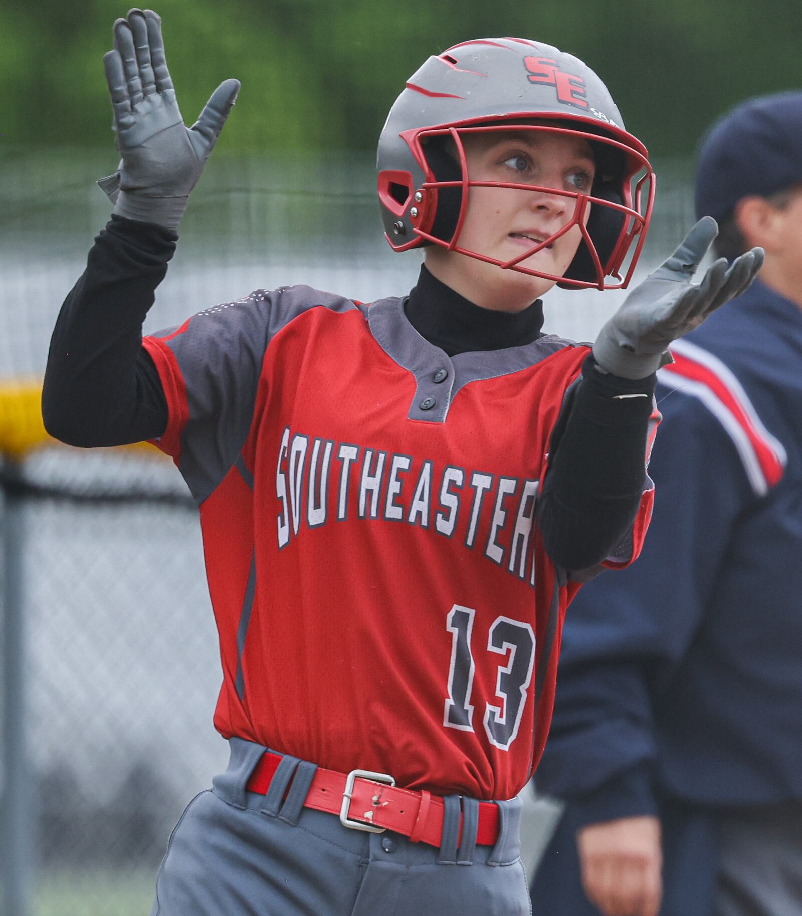 Southeastern junior Addi Vanover celebrates after scoring a run during a Division VII regional semifinal against Waynesfield-Goshen on Wednesday at Northmont High School. BRYANT BILLING / STAFF