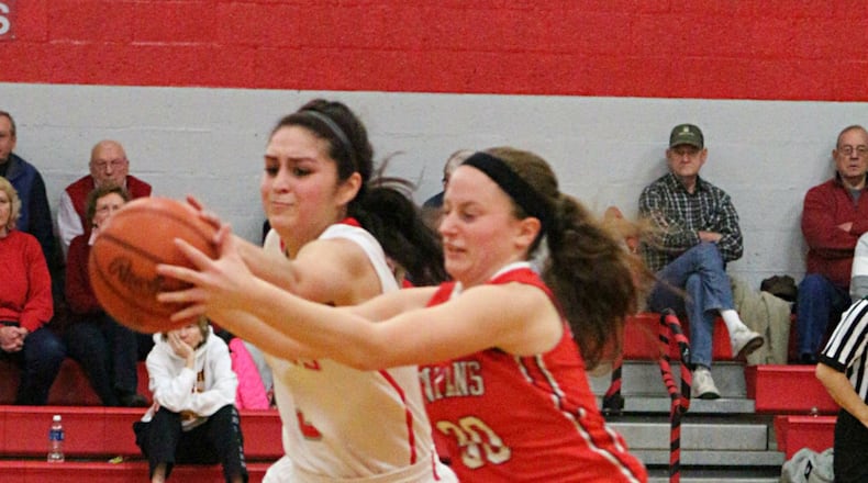 gbb2: Southeastern’s Leslie Flores (left) and Cedarville’s Maggie Coe battle for a loose ball. Contributed photo / Greg Billing