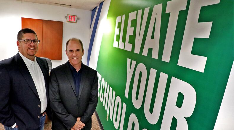 Tony Cooper and Kevin Schleinitz, owners at ProStratus, a Springfield-based IT company. BILL LACKEY/STAFF