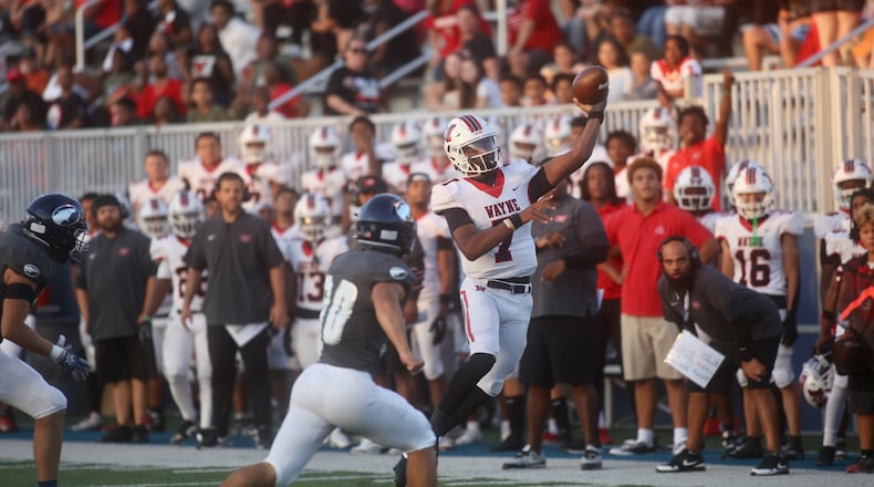 Wayne's Kye Graham throws a pass against Fairmont on Friday, Sept. 19, 2025, at Roush Stadium in Kettering. David Jablonski/Staff