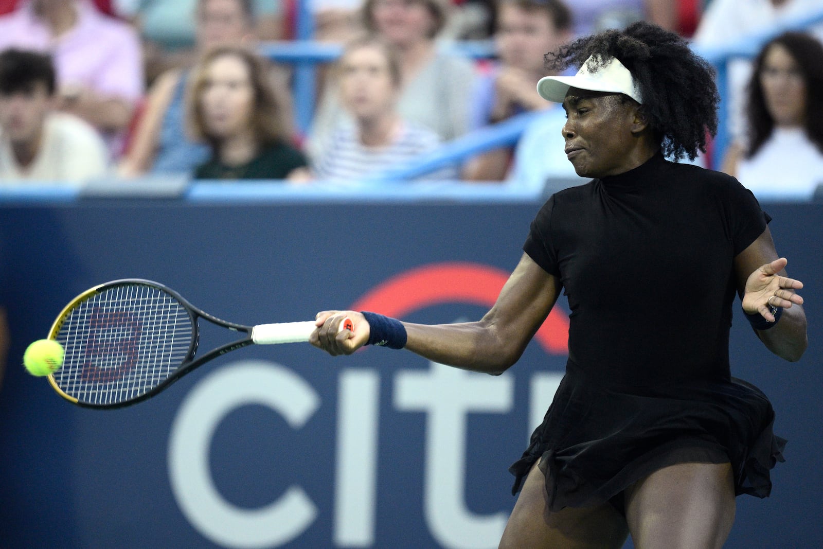 Venus Williams returns the ball against Peyton Stearns during a match at the Citi Open tennis tournament Tuesday, July 22, 2025, in Washington. (AP Photo/Nick Wass)