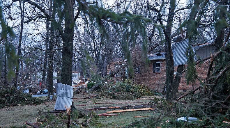 A damaged house and trees along Ridge Road Wednesay, Feb. 28, 2024. BILL LACKEY/STAFF